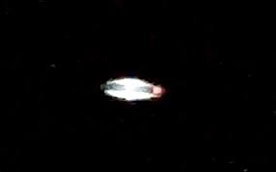 Archive photograph: a bright oval light in a black sky